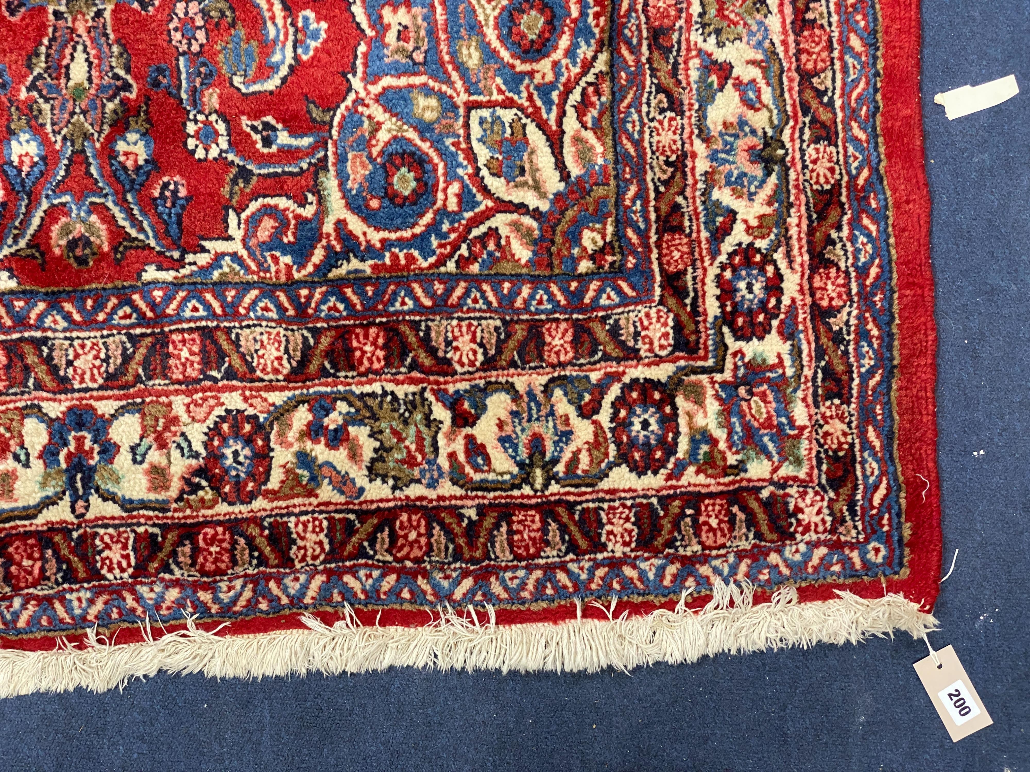 A Northwest Persian red ground rug, 240 cm x 136 cm